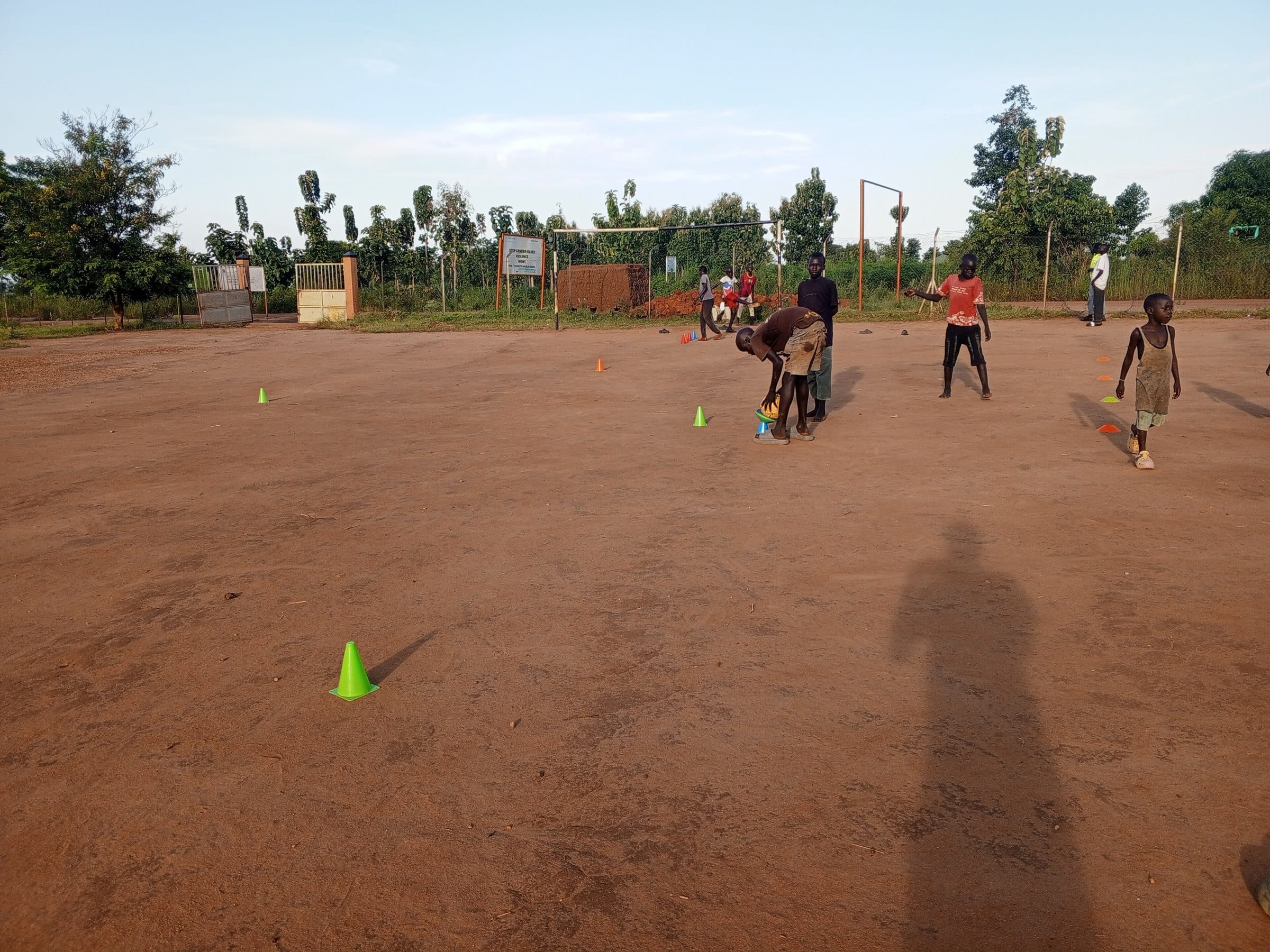Young people on a football pitch, playing for peace