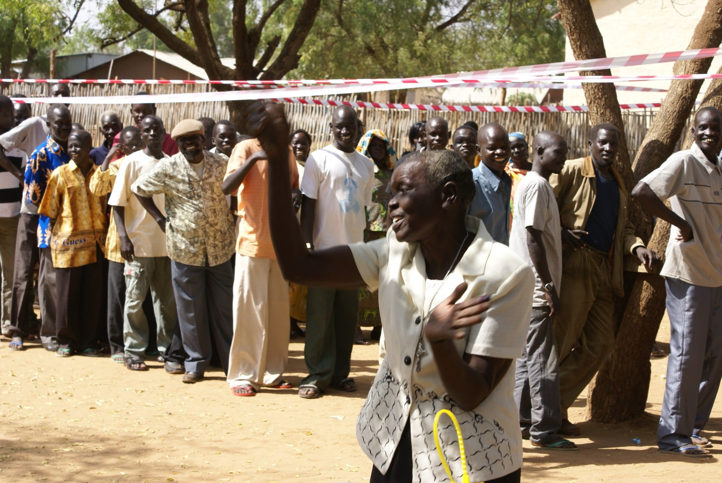 A woman dances with joy after casting her vote in Juba