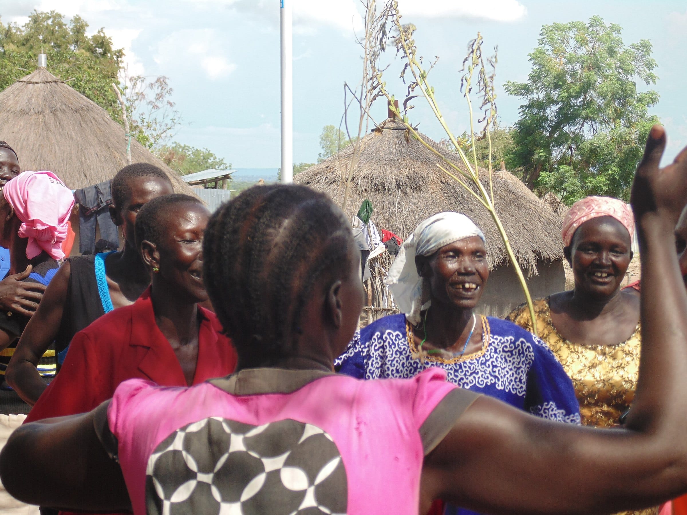 South Sudanese women dancing together outdoors