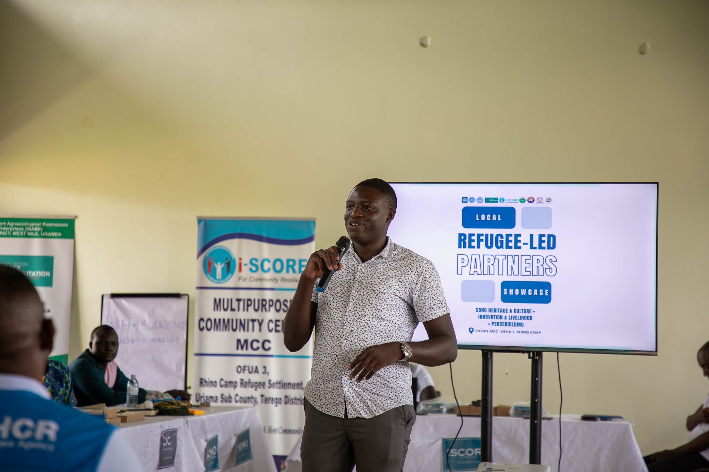 Mr. Wejuli Victor Nicodemus of the Office of the Prime Minister speaking at the showcase